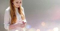 Cheerful girl texting on her phone