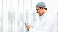 Muslim man using a phone