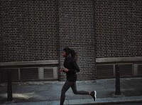 Sporty woman jogging in a city