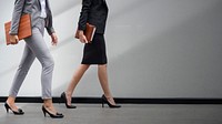 Two businesswomen walking in a corridor