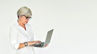 Elderly woman using a laptop