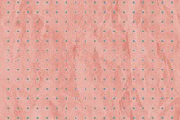 Crumpled pink dots paper textured background