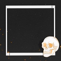 Gold skull frame on black background