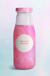 Shimmering pink drink in glass bottle with a label mockup