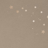 Shimmering gold stars on a beige background 