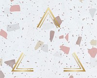 Gold triangle frame on a pastel patterned background
