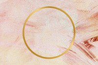 Gold round frame on a pink paintbrush stroke patterned background