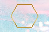 Gold hexagon frame on a pastel pink and blue concrete textured background