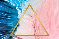 Gold triangle frame on a pink and blue paintbrush stroke patterned background