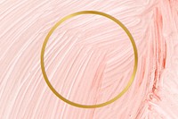 Gold round frame on a pastel pink paintbrush stroke patterned background