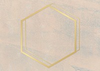 Gold hexagon frame on a rough beige background