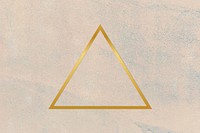 Gold triangle frame on a rough beige background