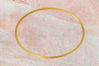 Gold oval frame on a rustic pastel pink background