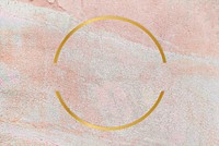 Gold round frame on a rustic pastel pink background