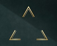 Gold triangle frame on a dark gray concrete textured background