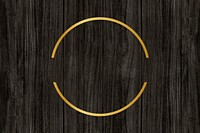 Gold circle frame on a wooden background