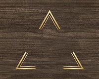 Gold triangle frame on a wooden background