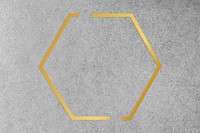 Gold hexagon frame on a gray concrete textured background