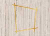 Gold trapezium frame on a wooden background