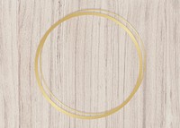 Gold circle frame on a wooden background