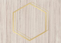 Gold hexagon frame on a wooden background