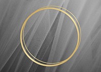 Golden framed circle on a gray fabric texture