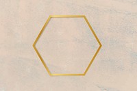 Gold hexagon frame on a rough beige background vector