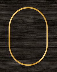 Gold oval frame on a wooden background
