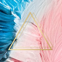 Gold triangle frame on a pink and blue paintbrush stroke patterned background vector