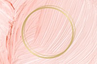 Gold round frame on a pastel pink paintbrush stroke patterned background vector