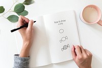 Woman doodling a candy on a white notebook mockup