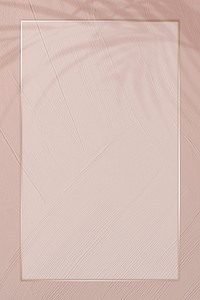 Gold border frame psd on dull pink background with leaf shadow