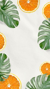 Green Monstera leaves and orange background