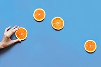 Delicious orange citrus fruit slices flat lay background