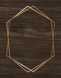 Golden frame hexagon on a wooden background