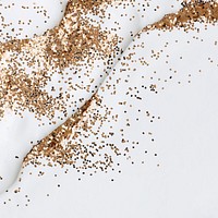 Gold glitter on white background