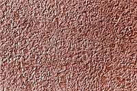 Roughly pink gold painted concrete wall surface background