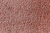 Roughly pink gold painted concrete wall surface background