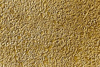 Roughly gold painted concrete wall surface background