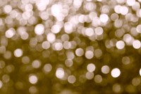 Blurry shiny gold glitter textured background