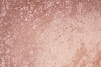 Roughly pink gold painted concrete wall surface background