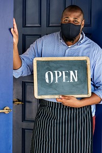 Black business owner in mask during new normal post pandemic