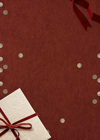 Christmas gift psd with confetti on red background