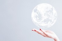White globe over woman&#39;s hand psd gray background