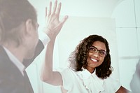 Businesswoman giving high five with colleague