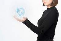 Businesswoman holding a digitally generated globe