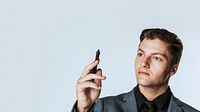 Young businessman holding stylus smart technology