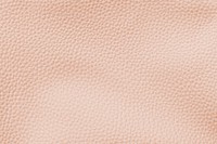 Pastel orange artificial leather textured background vector