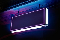 Blank purple neon sign board at cafe