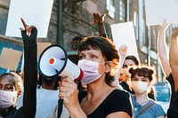 Diverse people wearing mask protesting during COVID-19 pandemic